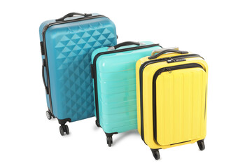 New yellow and light blue suitcases isolated on white