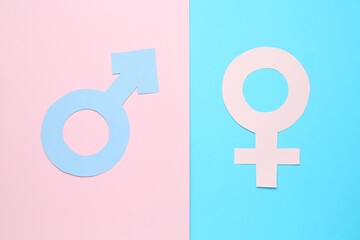 Gender equality concept. Male and female symbols on color background, flat lay