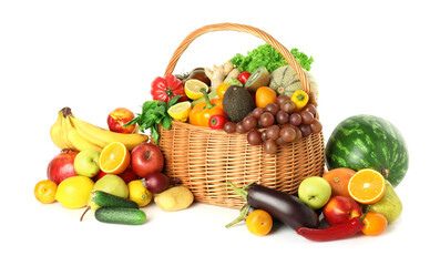 Many different fruits and vegetables in wicker basket isolated on white