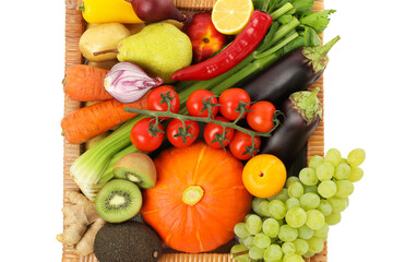 Different fresh fruits and vegetables in basket isolated on white, top view