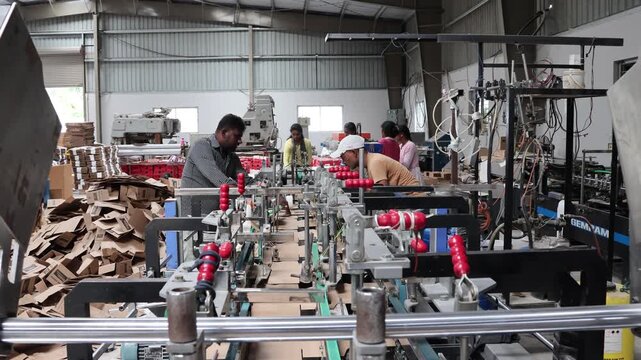 Bangalore, India 1st August 2024: Modern factory for the production of Corrugated Carton Boxes at a factory. warehouse storage, paper in the Products. Packaging Industry. Cartoning Solutions.