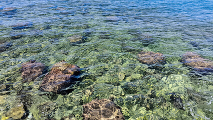 Adriatic sea surface with pebbles and stones 