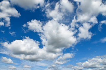 White clouds in the sky on a sunny day