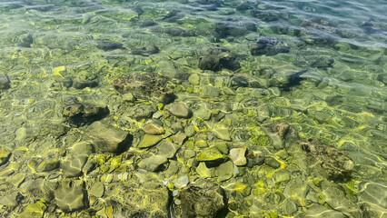 Adriatic sea surface with pebbles and stones 