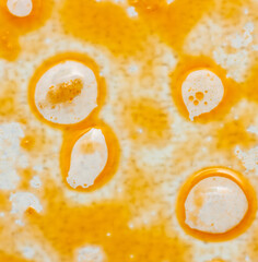 greasy round spots on white background.