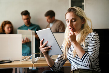 Programmers cooperating at IT company developing apps. People business work office concept