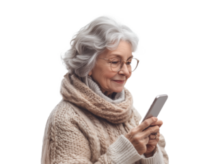 An elderly woman dressed in a warm, knitted sweater is enjoying her time indoors, engaged in using her smartphone. She appears delighted as she interacts with the device