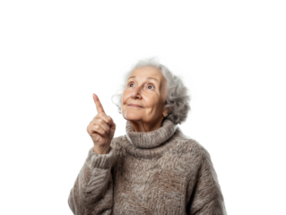 An elderly woman with curly gray hair is wearing a cozy sweater while she points upward with a thoughtful expression