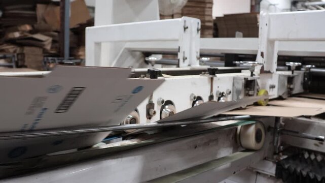 Bangalore, India 1st August 2024: Modern factory for the production of Corrugated Carton Boxes at a factory. warehouse storage, paper in the Products. Packaging Industry. Cartoning Solutions.