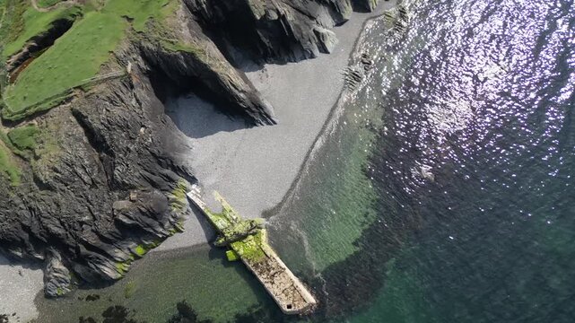 Aerial video over the coastline in Trefor Bay United Kingdom