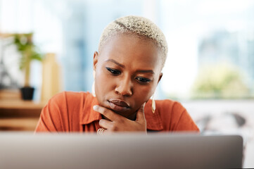 Black woman, thinking and laptop in office for reading, research and planning for article information. Workplace, female journalist and computer with brainstorming for online blog, business and story