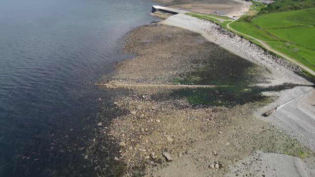 Aerial video over the coastline in Trefor Bay United Kingdom
