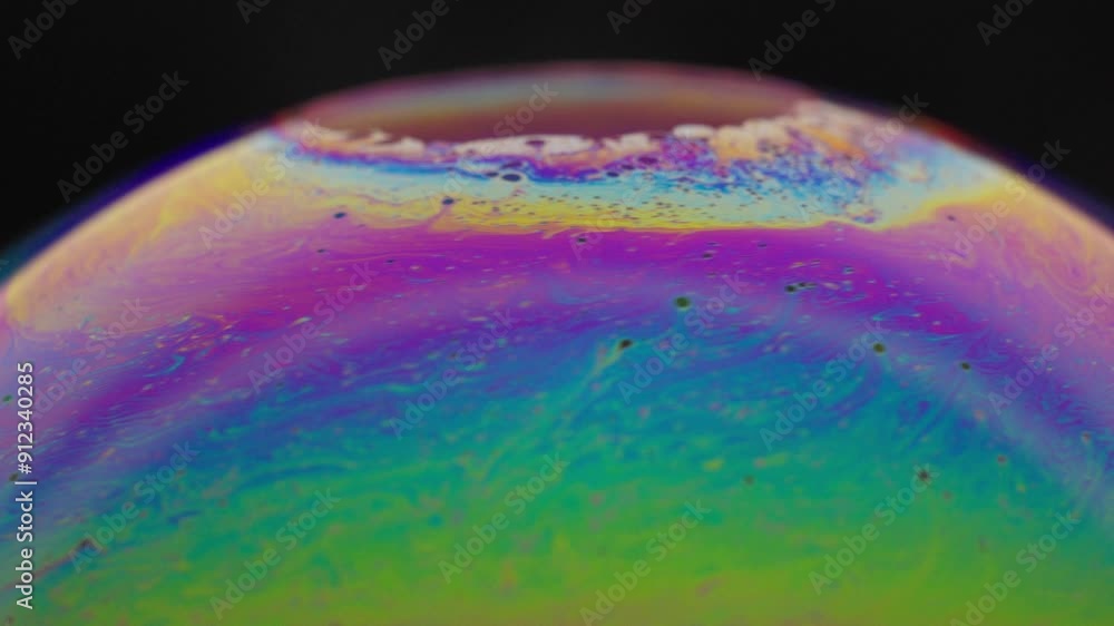 Poster vibrant close-up of colorful soap bubble with iridescent patterns on a black background