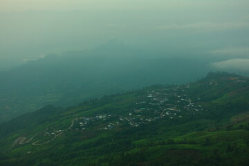 Top viwe point fog and sky in the morning with village on Phu Thap Boek is mountain in Phetchabun Province,Thailand.