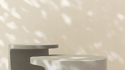 Two gray geometric round shape concrete cement table in dappled sunlight on cream white beige wall...