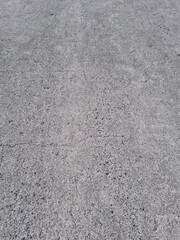 Close up of gray asphalt.