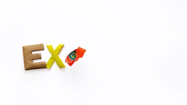 EXPLORE word spelled out in various fabrics, stop motion flat lay