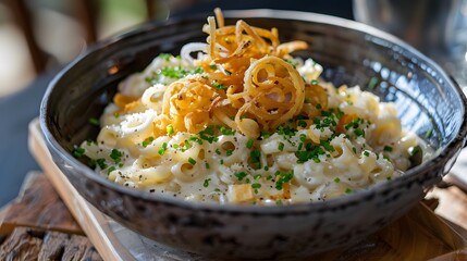 Spaetzle in a bowl garnished with grated cheese