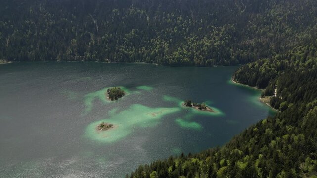 Shot of Eibsee lake , Germany, having clear water, surrounded by mountains covered by alpines , 3 lagoons, beautiful view