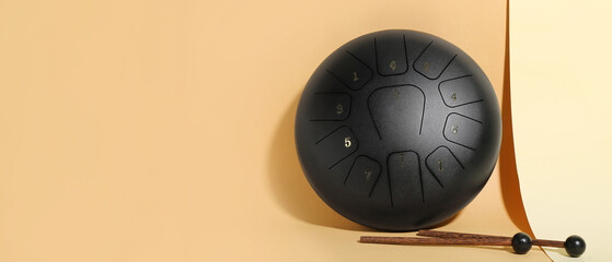 Glucophone with sticks on color background