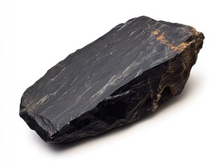 A single black rock sitting on a white surface