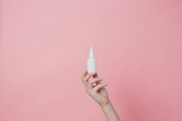 Glass unbranded white bottle with serum or essential oil with pipette. Natural moisturizing, nourishing cosmetics for skin, beauty and spa