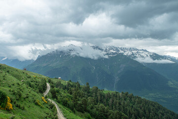Naklejka premium Magnificent mountains to trek in Mestia. Blooming mountain views in snowy weather in Mestia Georgia. Magnificent Mestia mountain views. Koruldi Lake trekking route.