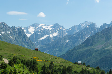 Fototapeta premium Magnificent mountains to trek in Mestia. Blooming mountain views in snowy weather in Mestia Georgia. Magnificent Mestia mountain views. Koruldi Lake trekking route.