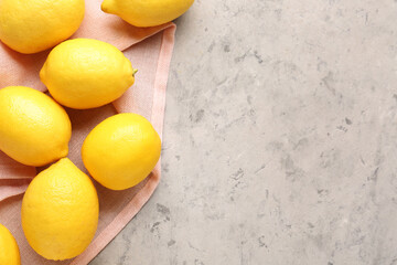 Fresh lemons on grey grunge background
