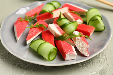 Plate with tasty crab sticks on light background, closeup © Pixel-Shot