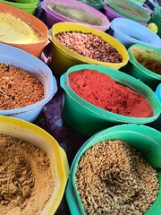 Street stand selling colorful and exotic spices. Exotic food in a street market. Colorful spices...