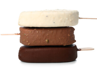 Different chocolate covered ice cream on stick against white background