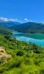 Fototapeta premium Triptych part 1 - Ananuri, a historic fortress complex in Georgia, is renowned for its stunning architecture and scenic location overlooking the Aragvi River.