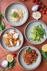 Fresh pasta dishes with ingredients on the side