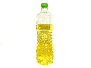 Cooking palm oil in a plastic bottle without label isolated on white background