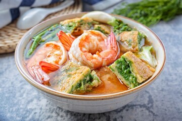 Shrimp Sour Soup with vegetable omelet , thai food, top view food table