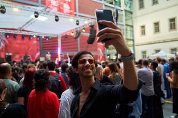Man Taking Selfie at Concert