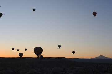 Hot air balloons at sunrise in Cappadocia, Türkiye (Turkey)