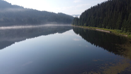 Aerial View of Tranquil Lake Surrounded by Forest in Rodopi Mountains