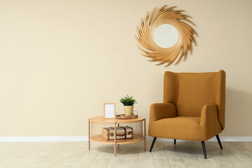 Minimalist interior of living room with brown armchair, coffee table and mirror
