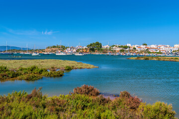 Fototapeta premium Alvor Portugal view from lagoon across and river marshes to Algarve town 