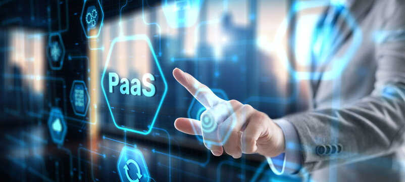 Hand pressing button on interface PaaS, Platform as a Service. Internet and networking concept