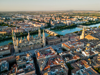 	
Spectacular Zaragoza city skyline at sunset. View of old town center, Cathedral of Zaragoza and Ebro River. Medieval and historic travel destination in Aragon - Spain. Sunset point, orange reflectio