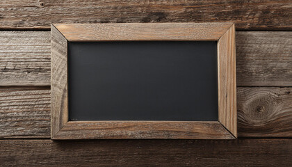 Empty blackboard with wooden frame on old wooden background. Mock-up. Close-up.