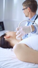 Obraz premium Doctor man wearing white protective gloves is using ultrasound equipment on the neck of patient woman, lying for examination. Medicine concept