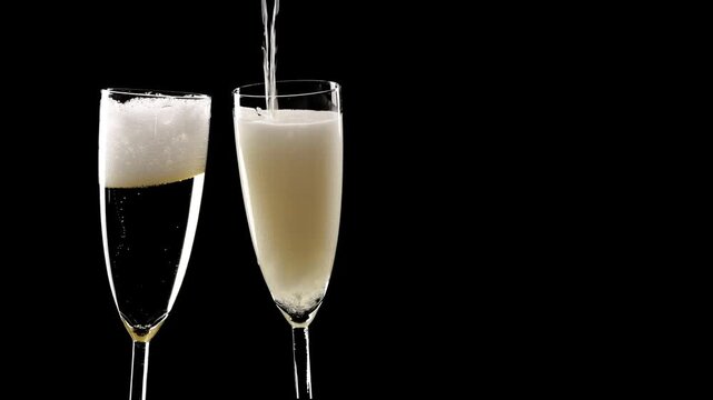 pouring champagne and toast with two glasses isolated on black background, fizzy drink motion design element overlay decoration texture for festive holiday events