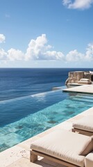 Fototapeta premium A luxurious infinity pool meets the calm ocean under a clear blue sky