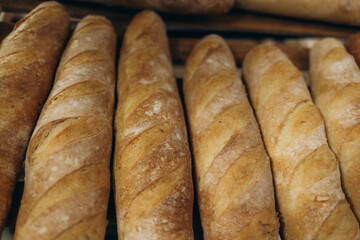 Baguette and bread. Craft bakery. Homemade pastries. Fresh bread in the bakery. French baguette