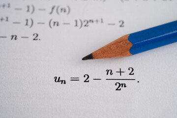Pencil on mathematic formula exercise test paper in education school.