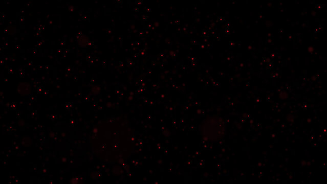 Abstract red particle background on black, dark bokeh, glowing dust particles
